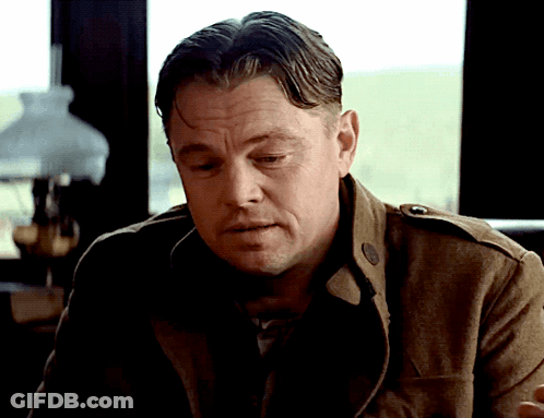 Man In Brown Jacket Looking Down GIF