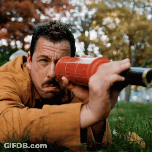 Man In Brown Jacket Looking Through Red UCSD Object GIF
