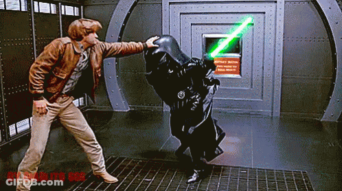 Man In Brown Jacket Next To Man With Green Lightsaber GIF