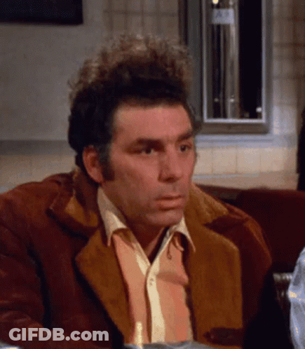 Man In Brown Jacket Sitting At Restaurant Table GIF