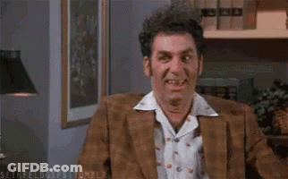 Man In Brown Jacket Sitting In Chair GIF