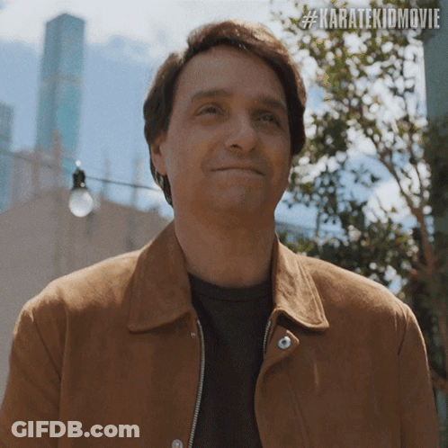 Man In Brown Jacket Smiling #Karatekidmovie GIF