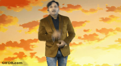 Man In Brown Jacket Standing In Sunset Sky GIF