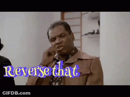 Man In Brown Jacket With Reverse That Sign GIF
