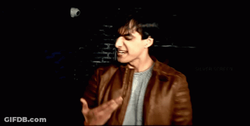 Man In Brown Leather Jacket With Silver Screen GIF