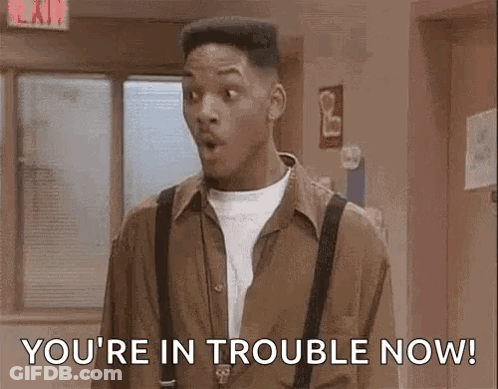 Man In Brown Shirt And Suspenders In Hallway GIF
