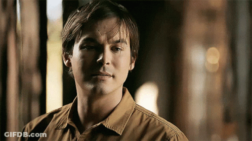 Man In Brown Shirt Close Up GIF