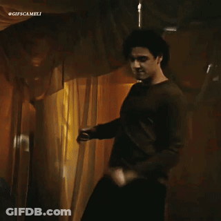 Man In Brown Shirt Dancing Before Curtain #Gifscamelli GIF