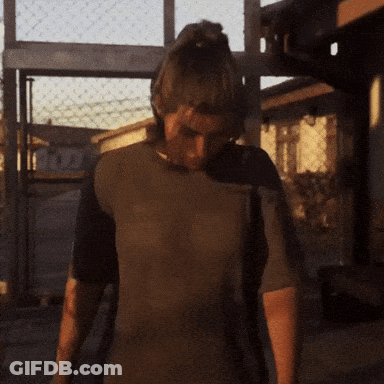 Man In Brown Shirt In Front Of Fence And Fox Building GIF