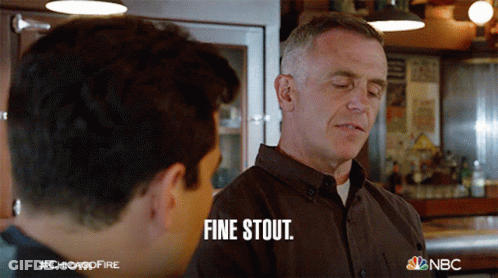 Man In Brown Shirt Saying Fine Stout To Another GIF