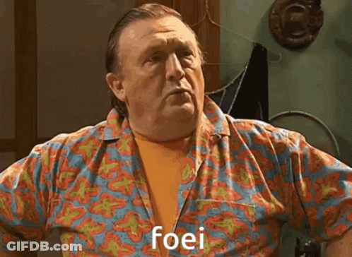 Man In Brown Shirt Saying Fine Stout To Man GIF