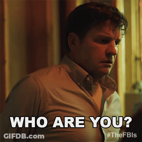Man In Brown Shirt Says Who Are You GIF