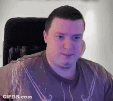 Man In Brown Shirt Sitting In Chair GIF