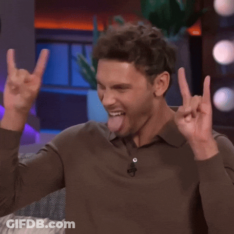Man In Brown Shirt Sticking Tongue Out Making Horn Sign GIF