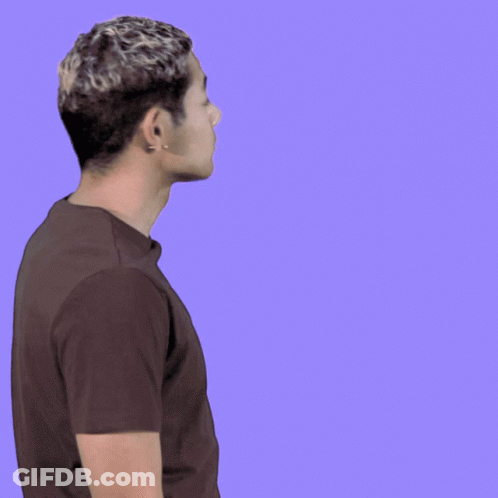 Man In Brown Shirt Waving In Front Of Oh H Sign GIF