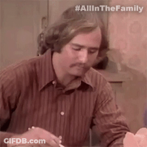 Man In Brown Striped Shirt Sitting At Table With Knife And Fork GIF