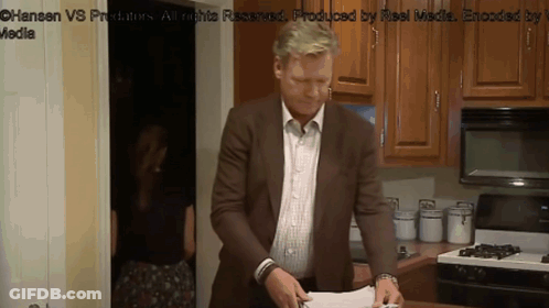 Man In Brown Suit At Stove GIF