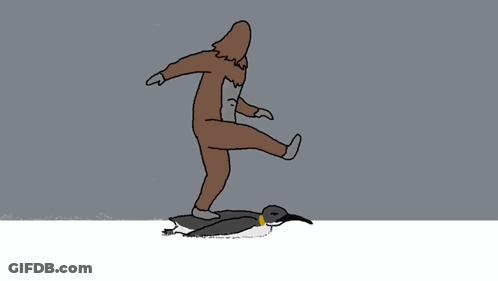 Man In Brown Suit Standing Next To Penguin GIF