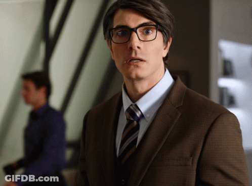 Man In Brown Suit Surprised GIF