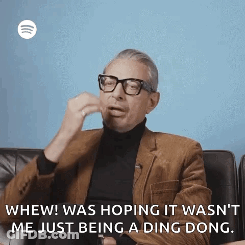 Man In Brown Suit Talking GIF