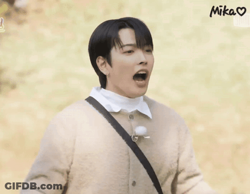 Man In Brown Sweater White Shirt Hands Up GIF