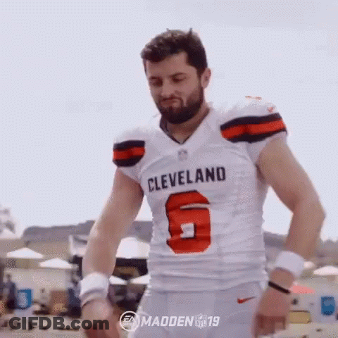 Man In Browns Jersey On Beach GIF