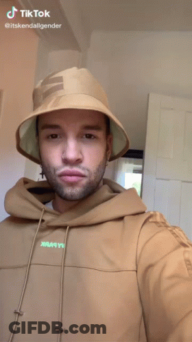Man In Bucket Hat And Hoodie Making Funny Face Saying TikTok GIF