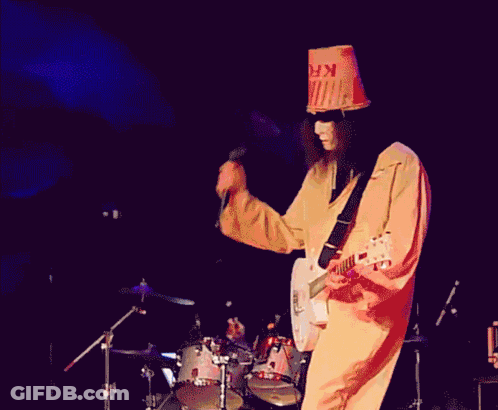 Man In Bucket Hat Playing Guitar On Stage GIF