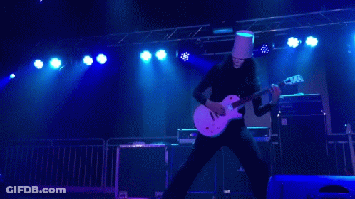 Man In Bucket Hat Playing Guitar On Stage GIF