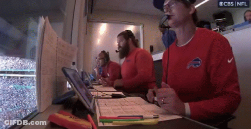 Man In Buffalo Bills Jersey Writing With Pen GIF