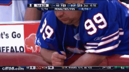 Man In Buffalo Bills Jersey Writing With Pen GIF