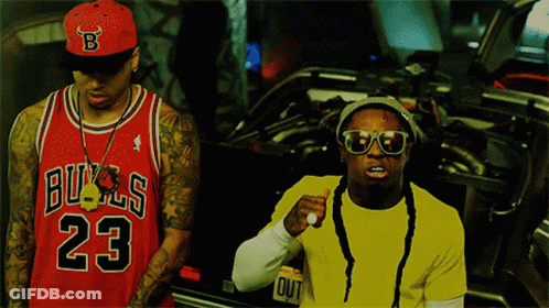 Man In Bulls Jersey Next To Man In Yellow Shirt GIF