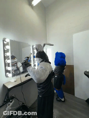 Man In Bunny Costume Blow Drying Hair GIF