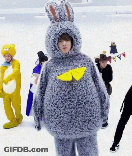 Man In Bunny Costume Next To Group In Costumes GIF