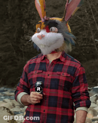 Man In Bunny Mask Holding Can GIF