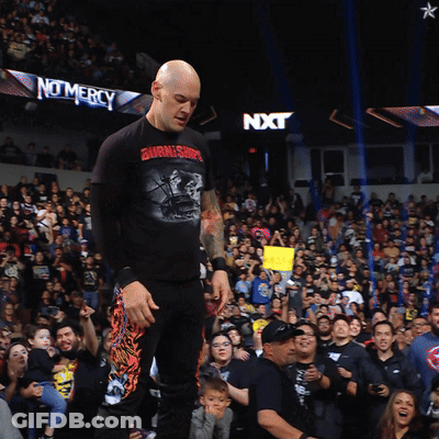 Man In Burning Ship Shirt In Crowd GIF