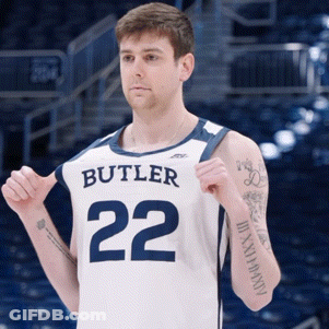 Man In Butler 22 Jersey Holding Shirt Up GIF