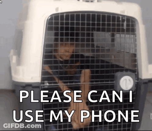 Man In Cage Saying Please Can I Use My Phone GIF