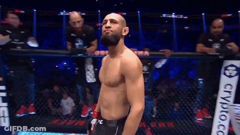 Man In Cage With Crypto.co Sign GIF