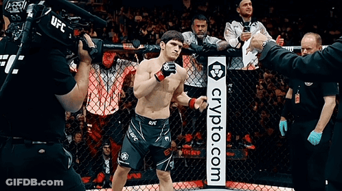 Man In Cage With Crypto.com Sign GIF