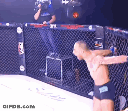 Man In Cage With FIFA Sign GIF