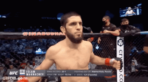 Man In Cage With Islam On Chest GIF