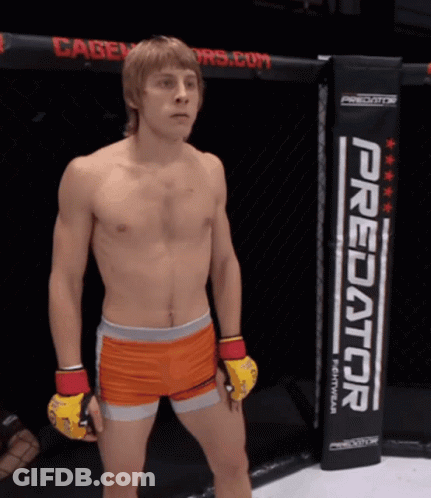 Man In Cage With Predator Sign GIF
