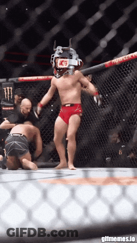 Man In Cage With UFC Helmet GIF