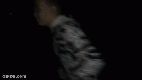 Man In Camouflage Jacket Dark GIF