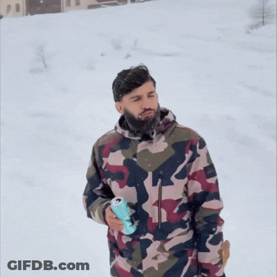 Man In Camouflage Jacket Walking In Snow GIF