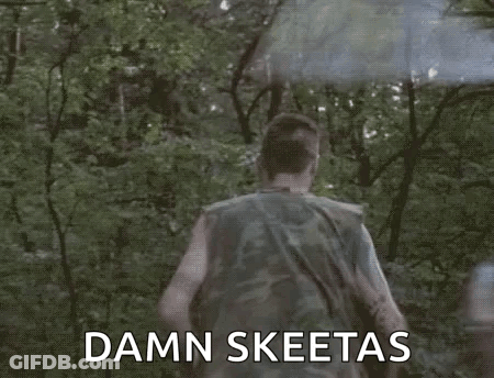 Man In Camouflage Running Through Woods With Smoke Bomb GIF
