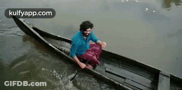 Man In Canoe With National Geographic Logo GIF