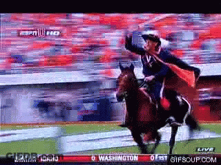 Man In Cape Riding Horse In Front Of Washington Sign GIF