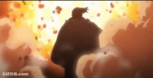 Man In Cape Standing Before Large Explosion GIF